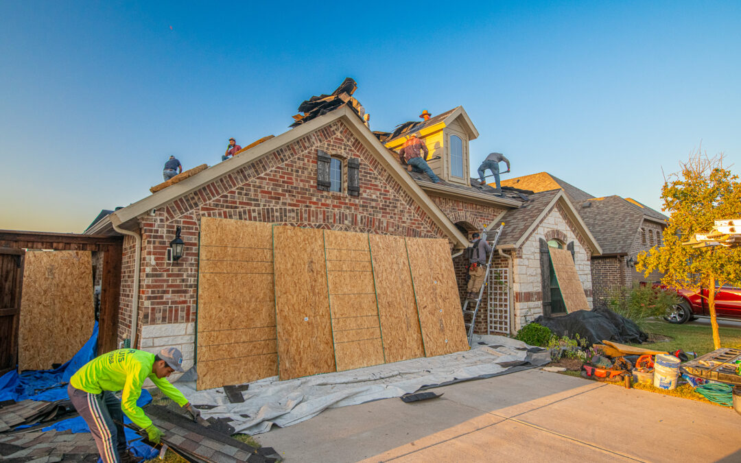 Roofers in North Texas replacing shingles