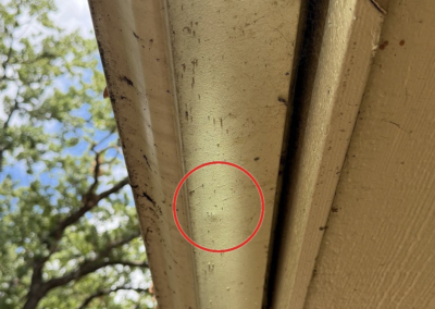 Hail damage on a gutter